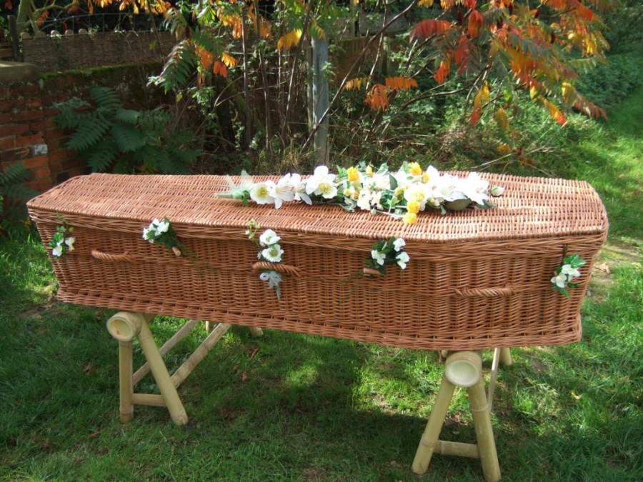 Respect direct cremations coffin prepared for cremation with beautiful decor.