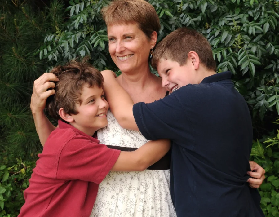 Mum and her two sons grieving where often laughter and tears often coexist in these moments of grief with the support of Respect funeral services.