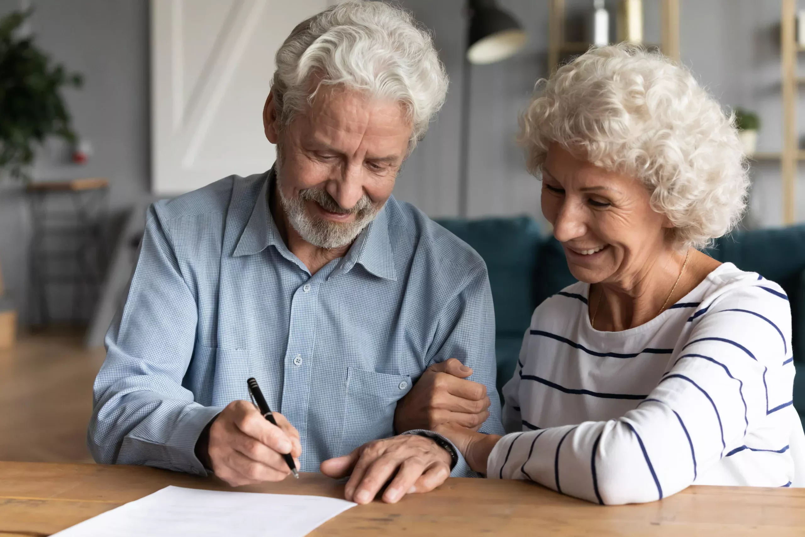 Elderly couple outlining estate planning wishes, considering direct funerals at Respect.
