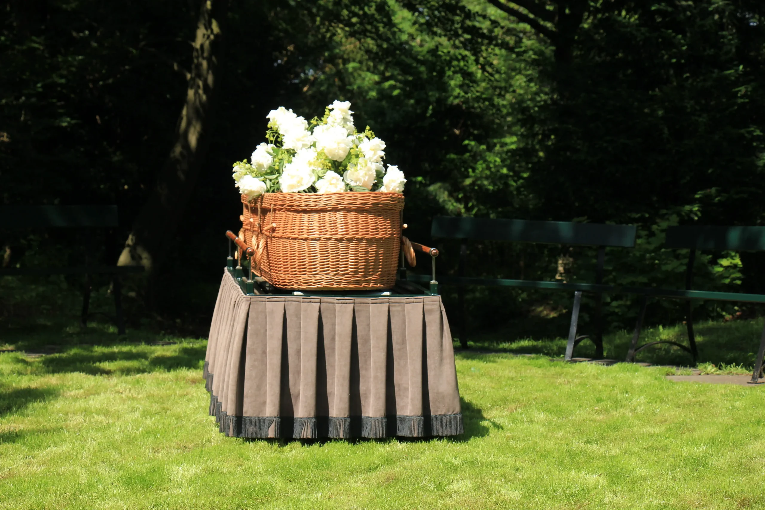 A green burial with a biodegradable coffin prepared for burial